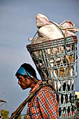 Myanmar - Kyaikhtiyo, porters carrying luggage's of the pilgrims. 